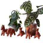 Terracotta animal figurines with potted plants 