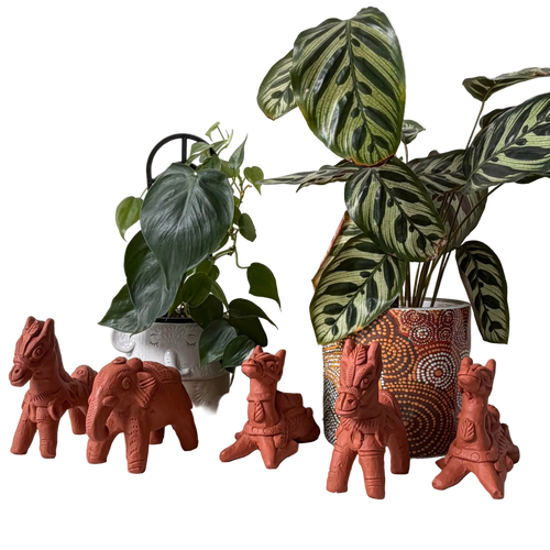 Terracotta animal figurines with potted plants 